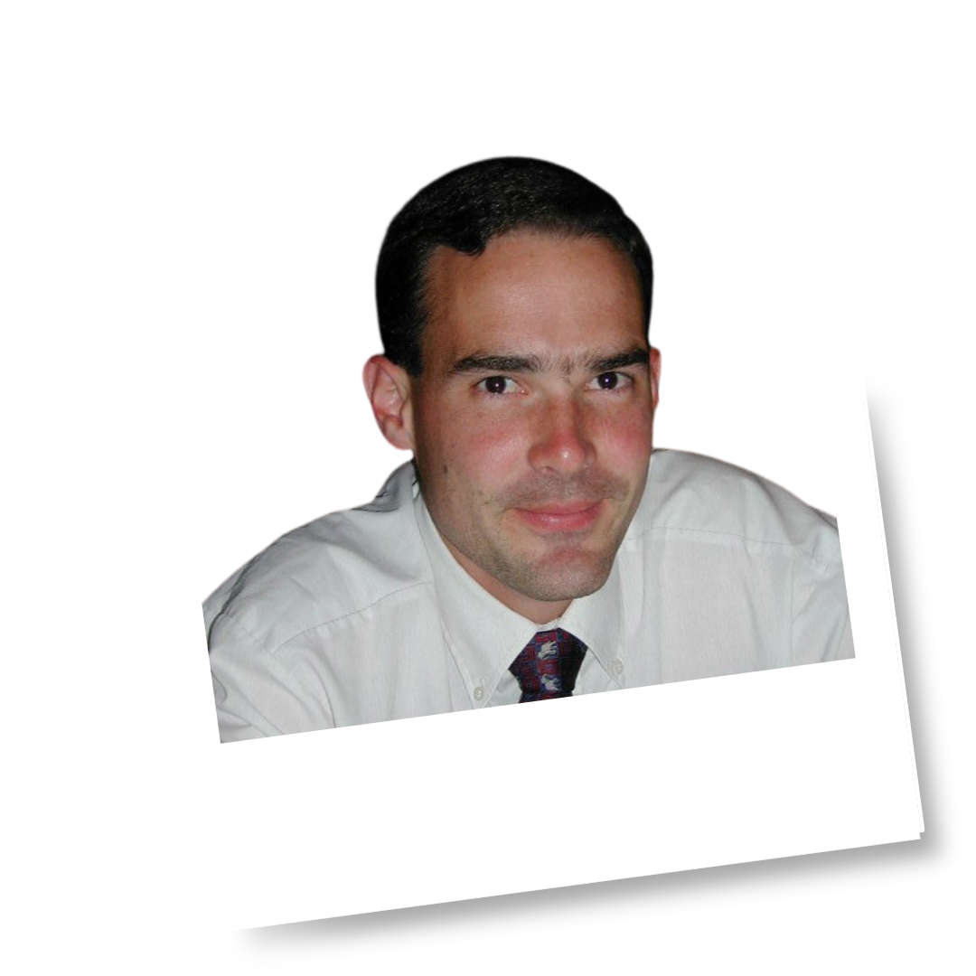 Headshot of a man in white shirt and tie
